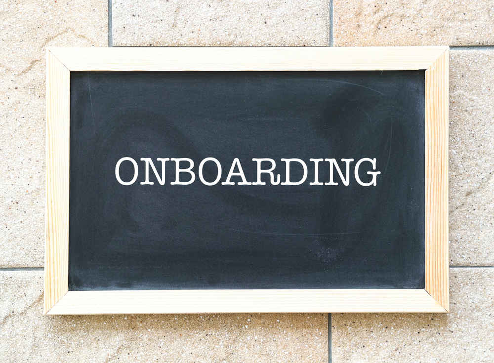 Onboarding, words printed on blackboard, a business or human resources cum training concept